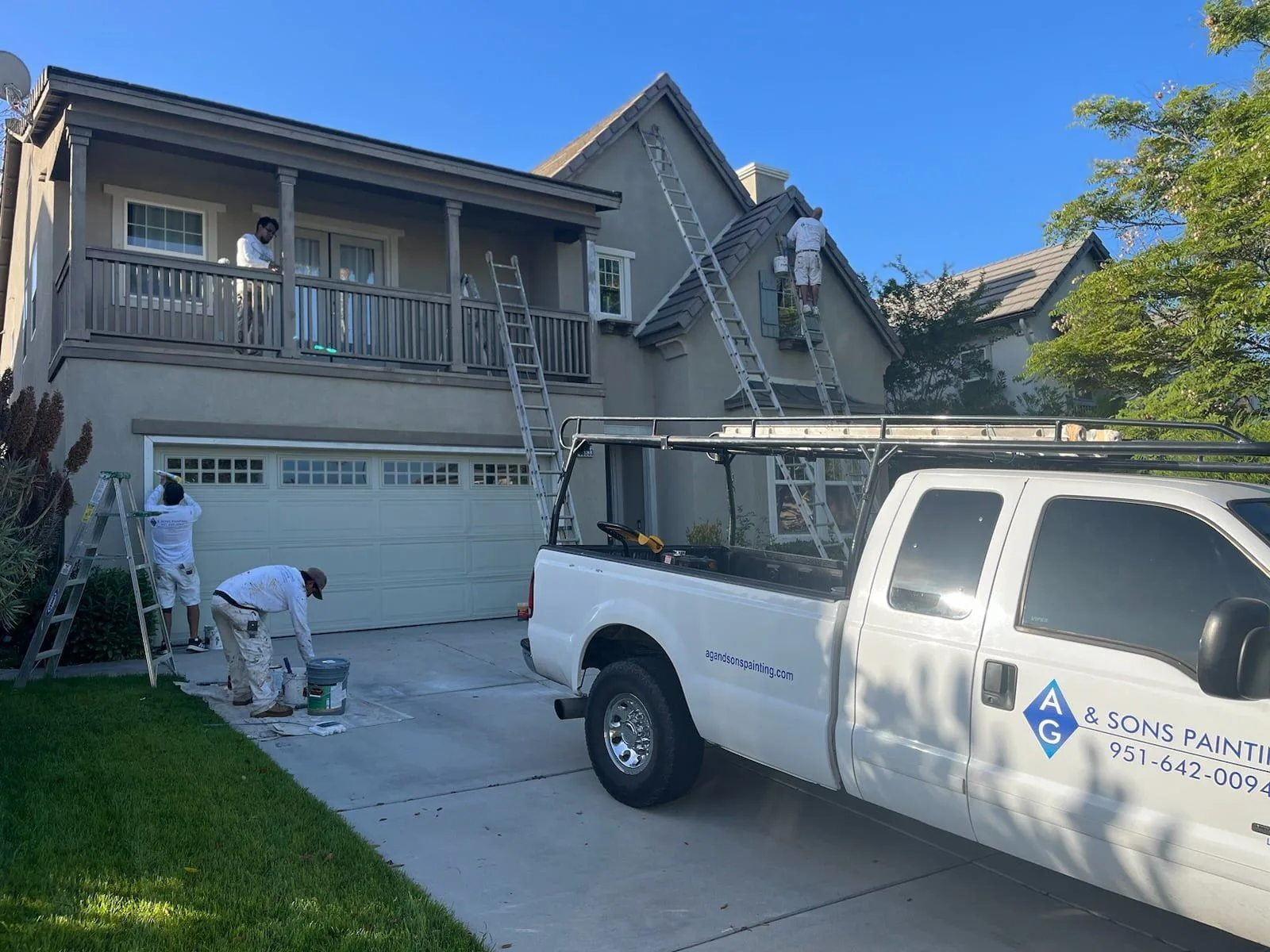 Crew painting a two-story exterior