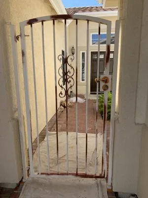 Spot prime on gate prevents rust from coming back